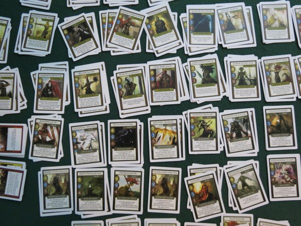 Here we divided them out into individual stacks to play the deck-building variant, but then it seemed so daunting that we just shuffled them back together to play normally.