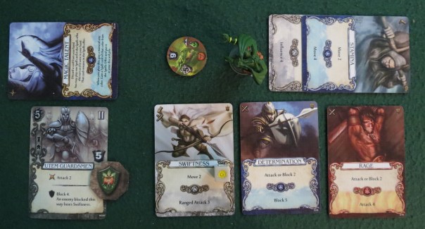 Combat is resolved in phases. The first is the Ranged Phase: If you can kill an enemy with ranged or siege cards, then they will never have the chance to attack you at all. This isn't always so easy. Not only are ranged cards rarer than normal attack cards, but if your enemy is fortified, ranged cards will not work. There are even ways to block siege cards, in which case you'll need some sort of special ability (or be willing to take a few hits) to win. And you can't inflict partial hits on an enemy now and finish them off later — combat is all-or-nothing, and you need to inflict enough hits to kill. The second phase gives you a chance to Block your enemy's attack, and again, you need to play enough block actions to block *all* damage, since you cannot block only part of an attack. In this case, exhausting the Utem Guardsmen plus a sideways card for +1 block was enough to match the Swamp Dragon's 5 attack. Combat is resolved in phases. The first is the Ranged Phase: If you can kill an enemy with ranged or siege cards, then they will never have the chance to attack you at all. This isn't always so easy. Not only are ranged cards rarer than normal attack cards, but if your enemy is fortified, ranged cards will not work. There are even ways to block siege cards, in which case you'll need some sort of special ability (or be willing to take a few hits) to win. And you can't inflict partial hits on an enemy now and finish them off later — combat is all-or-nothing, and you need to inflict enough hits to kill. The second phase gives you a chance to Block your enemy's attack, and again, you need to play enough block actions to block *all* damage, since you cannot block only part of an attack. In this case, exhausting the Utem Guardsmen plus a sideways card for +1 block was enough to match the Swamp Dragon's 5 attack.