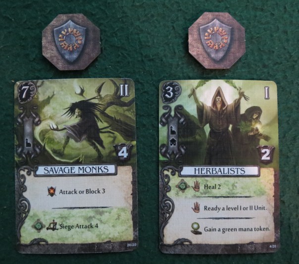These are units. How many you can command depends on your level. Their influence cost is on the top-left, with their hiring location beneath that (Savage Monks in monastery only, Herbalists in either monastery or village). They have an armor value that they can use to take wounds for you, and you can choose one of their abilities per day or night before they are exhausted. Note that the Herbalists can "ready" units to un-exhaust them. Units are the aspect of this game that I always forget about when I'm trying to figure out battles, so I don't use them as often as I could. I did fine in this game though. These are units. How many you can command depends on your level. Their influence cost is on the top-left, with their hiring location beneath that (Savage Monks in monastery only, Herbalists in either monastery or village). They have an armor value that they can use to take wounds for you, and you can choose one of their abilities per day or night before they are exhausted. Note that the Herbalists can "ready" units to un-exhaust them. Units are the aspect of this game that I always forget about when I'm trying to figure out battles, so I don't use them as often as I could. I did fine in this game though.