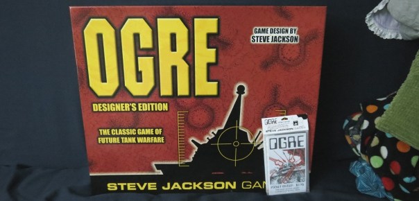 I was going to crop out the blanket, baby-carrier, burp rag, and pillow, but I decided it was sort of a metaphor for baby intrusion into my board gaming life, so I left it in. ART.