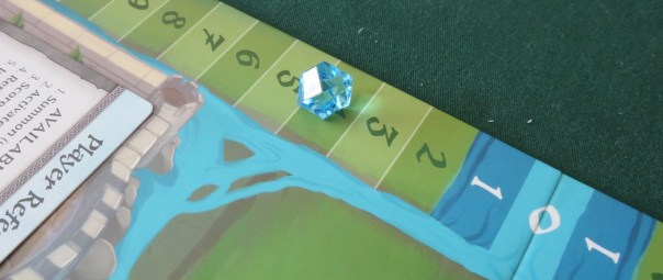Too bad about the little gem, though. Since it's a little bit rolly, it sometimes misses its number. A flat token would have been better, if not as cool to look at.