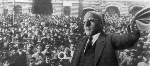 It looks like he's trying to sell newspapers.