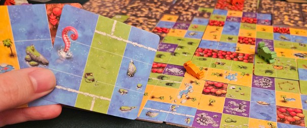 My 9yo literally spends the whole game pointing out which illustrated features appear on her cards. And she does not care that it violates the no-talking rule.