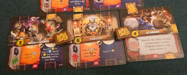 The Weirdlings' day/night cycle is the real standout, both because it comes with a coin that you flip to mark the passage of time and because I suck at managing its alternating bonuses.