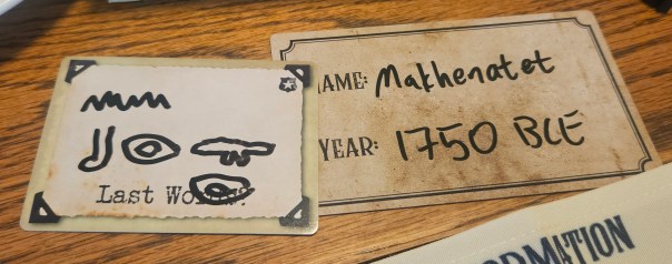 SPOILERS! According to some rando hieroglyphics translator, this reads "No, brother," which identifies the killer. BUT I was mostly using the individual hieroglyphs because they looked like walking through grass looking for crocodiles, which would communicate the activity the victim was performing at the time of their death. SPOILERS! According to some rando hieroglyphics translator, this reads "No, brother," which identifies the killer. BUT I was mostly using the individual hieroglyphs because they looked like walking through grass looking for crocodiles, which would communicate the activity the victim was performing at the time of their death.