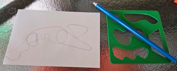 somebody guessed a vacuum cleaner. clearly it's an alligator.