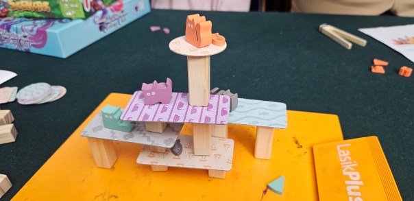 In theory, you can bonk a toy off other pieces to try to keep them on the tower. In practice, you wind up with like one main tower, so either you gently brush it off the edge and it doesn't rebound too far or it just pings off into nothingness.